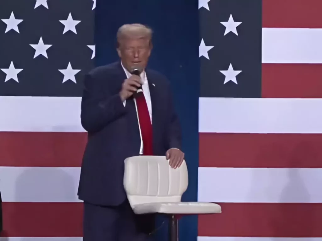 Trump falls out of chair